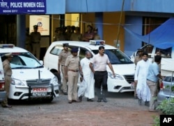 Bishop of the Indian city of Jalandhar, Franco Mulakkal, center, leaves after being questioned by police in Kochi, India, Sept. 19, 2018.