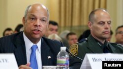 FILE - From left, U.S. Homeland Security Secretary Jeh Johnson and U.S. Customs and Border Protection Deputy Chief Ronald Vitiello testify at a House Homeland Security Committee hearing on Capitol Hill in Washington, June 24, 2014. 