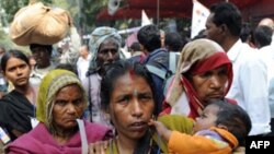 Activists of The National Confederation of Dalits (untouchables) Organisations carry their belongings during a protest New Delhi on February 23, 2009. The activists demanded the reservation of jobs in the private sector for Schedule Castes (SC), Schedul