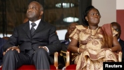 FILE - Ivory Coast President Laurent Gbagbo and his wife Simone Ehivet Gbagbo attend a memorial ceremony at Felix Houphouet Boigny stadium in Abidjan.