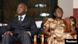 FILE - Laurent Gbagbo and his wife Simone Ehivet Gbagbo attend a memorial ceremony at Felix Houphouet Boigny stadium in Abidjan.