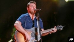 FILE - Chris Young performs at the CMA Music Festival at Nissan Stadium in Nashville, Tennessee, June 11, 2016. Young is donating $100,000 for disaster relief efforts in Texas.
