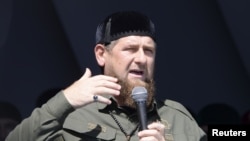 FILE - Head of the Chechen Republic Ramzan Kadyrov delivers a speech during a rally in support of Muslim Rohingya following the recent violence, which erupted in Myanmar, in the Chechen capital Grozny, Russia, Sept. 4, 2017.