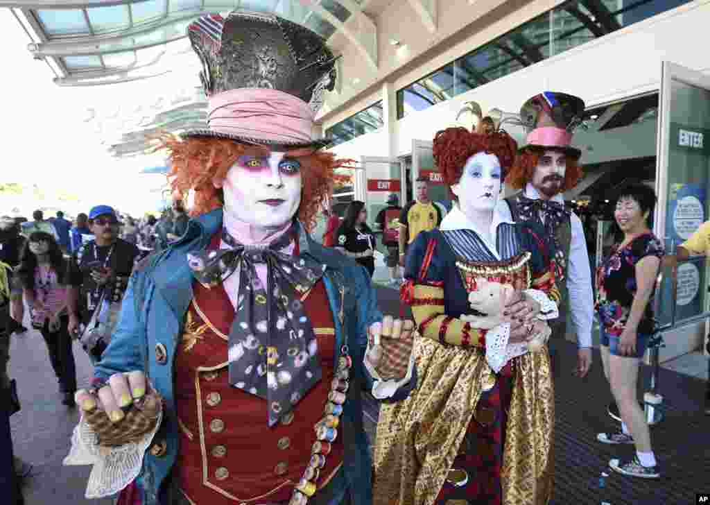Members of the League of Hatters walk in front of the convention center on day one of Comic-Con International held at the San Diego Convention Center, in San Diego, California, July 21, 2016.