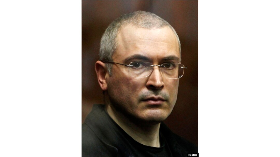 FILE - Russian former oil tycoon Mikhail Khodorkovsky stands in the defendants' cage during a court session in Moscow in 2010.
