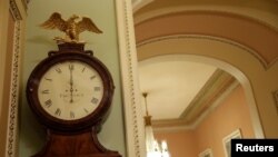 The Ohio Clock shows midnight to begin the government shutdown outside the Senate chamber on Capitol Hill in Washington, Jan. 20, 2018.