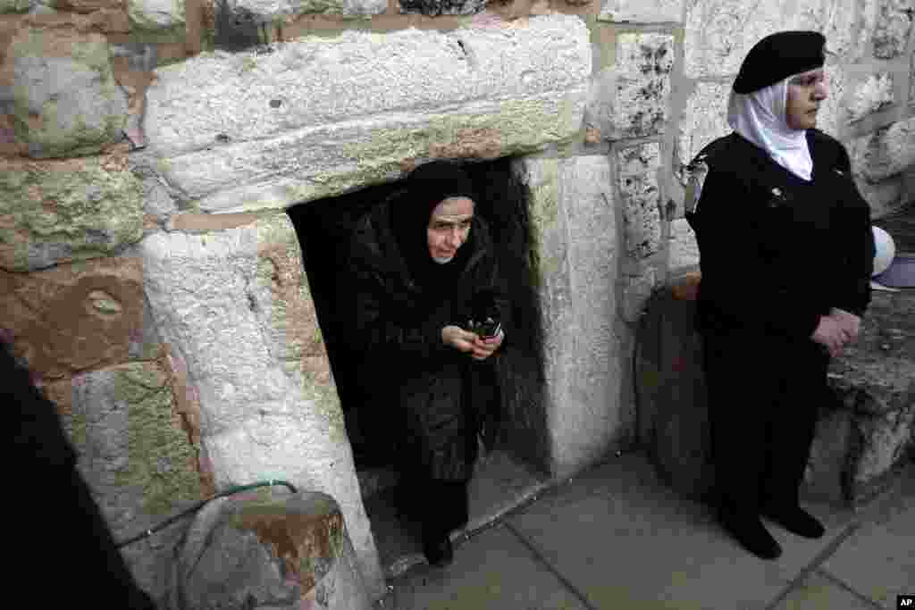 A Christian worshiper walks out of the Church of Nativity in the West Bank town of Bethlehem, December 24, 2012. 