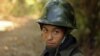 FILE - A Kachin rebel stands guard on Hka Ya mountain in Kachin province, Myanmar, Jan. 20, 2013.