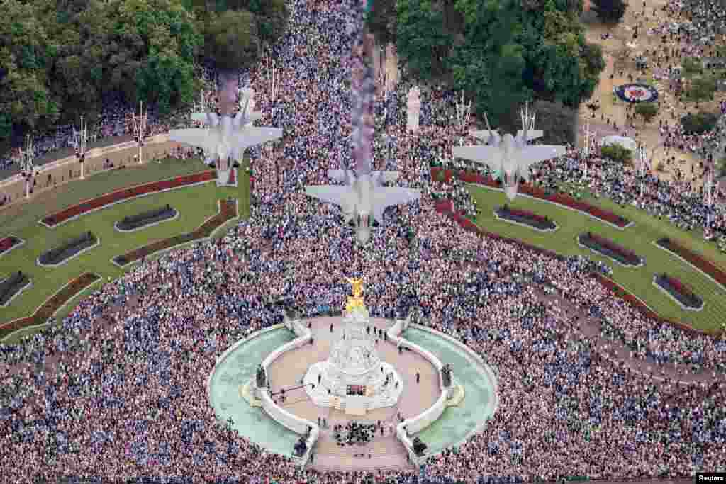 Several F-35 Lightening jets fly over the Queen Victoria Memorial and Buckingham Palace to mark the centenary of the Royal Air Force, in London.