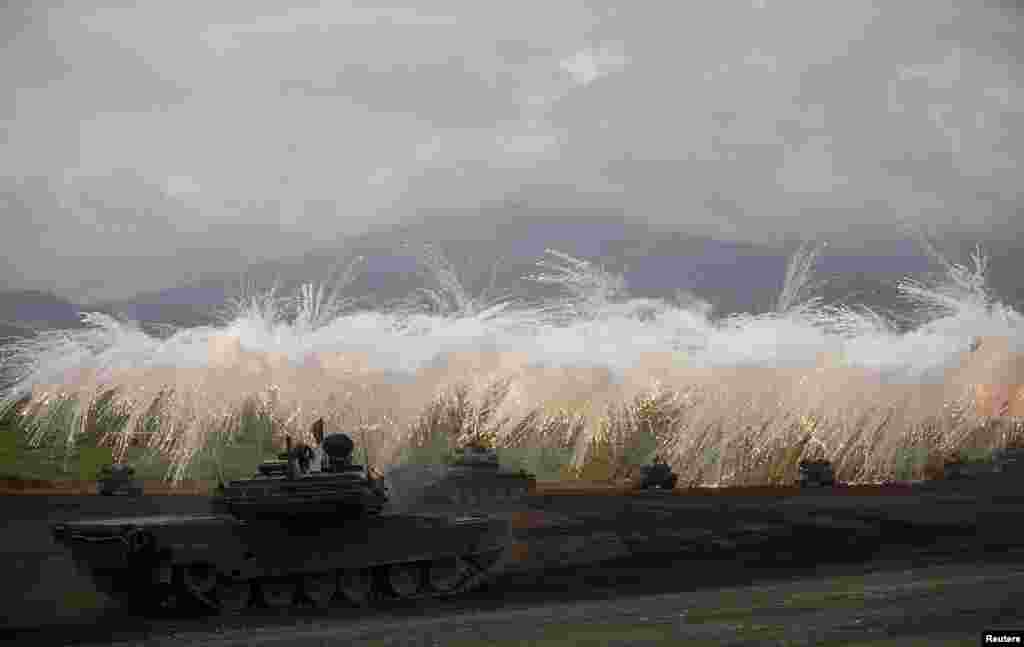 Japanese Ground Self-Defense Force armoured tanks fire during an annual training session near Mount Fuji at Higashifuji training field in Gotemba, west of Tokyo.