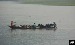 Locals move their goats in a boat to safer ground after Cyclone Fani hit the coastal eastern state of Odisha, on the river Brahmaputra in Gauhati, India, May 3, 2019.