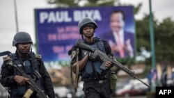 Members of the Cameroonian Gendarmerie patrol in the Omar Bongo Square of Cameroon's mostly anglophone South West province capital Buea, Oct. 3, 2018, during a campaign rally of the ruling CPDM party of incumbent Cameroonian President Paul Biya.