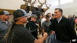 Mitt Romney shaking hands during a campaign stop at the Sportsmen for Fish and Wildlife Banquet, in Blanding, Utah, March 2, 2018.