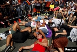 FILE - Members of Gays Against Guns hold a "die-in" during the annual NYC Pride parade in New York City, New York, June 26, 2016.