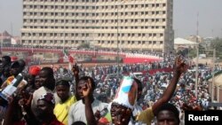 All Progressives Congress party supporters gather to welcome presidential candidate Muhammadu Buhari in Kano, January 20, 2015. As Nigeria approaches its most divisive and closely fought election since the end of military rule in 1999, its leaders are having to reassure voters that Africa's most populous nation will remain in one piece. 
