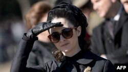 FILE - Actress Natalie Portman, in the role of Jacqueline Kennedy, is seen outside the White House while filming a scene for the movie "Jackie" on Pennsylvania Avenue in Washington, D.C., Feb. 28, 2016.