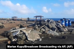 FILE - This photo provided by Broadcom Broadcasting shows a damaged area in Nuku'alofa, Tonga, Thursday, Jan. 20, 2022, following Saturday's volcanic eruption near the Pacific archipelago.