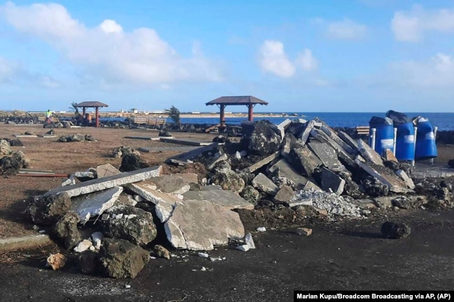FILE - This photo provided by Broadcom Broadcasting shows a damaged area in Nuku'alofa, Tonga, Thursday, Jan. 20, 2022, following Saturday's volcanic eruption near the Pacific archipelago.