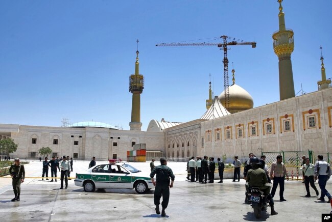 Police officers patrol the scene, around the shrine of late Iranian revolutionary founder Ayatollah Khomeini, after an attack by several perpetrators in Tehran, Iran, June 7, 2017.