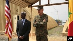 Gen. Thomas D. Waldhauser, right, commander of U.S. Africa Command, is joined by U.S. Ambassador to Senegal Tulinabo S. Mushingi on a tour of a cooperative security location Camp Cisse where the U.S. maintains a small site that allows for U.S. military aircraft to land and refuel, or for storage and use during crisis situations in Dakar, Senegal, July 30, 2018.