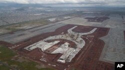 FILE - Progress is seen on the construction of new airport in Texcoco, Mexico, Oct. 17, 2018.