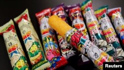 Several kinds of 'Umaibo', a popular Japanese corn snack, are seen at a store in Tokyo, Japan January 25, 2022. (REUTERS/Akira Tomoshige)