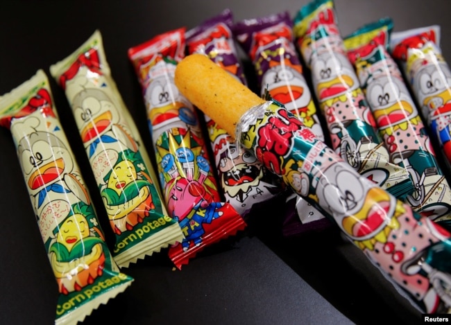 Several kinds of 'Umaibo', a popular Japanese corn snack, are seen at a store in Tokyo, Japan January 25, 2022. (REUTERS/Akira Tomoshige)