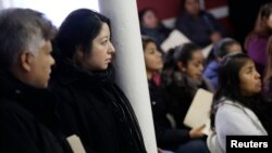FILE - Migrants attend a workshop for legal advice held by the Familia Latina Unida and Centro Sin Fronteras at Lincoln United Methodist Church in south Chicago, Illinois, Jan. 10, 2016. 