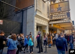 FILE - People line up to see the Broadway play "Hamilton," Nov. 19, 2016, in New York.