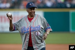 Former Negro League player and team owner Minnie Forbes throws out a ceremonial first pitch prior to a baseball game between the Detroit Tigers and Cleveland in Detroit, July 1, 2017.