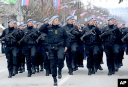 Members of police forces of Republic of Srpska march during a parade marking 25th anniversary of Republic of Srpska in the Bosnian town of Banja Luka, Bosnia, Jan. 9, 2017.