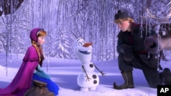 This image released by Disney shows, from left, Anna, voiced by Kristen Bell, Olaf, voiced by Josh Gad, and Kristoff, voiced by Jonathan Groff in a scene from the animated feature "Frozen." (Disney)