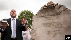 FILE - Poland's chief rabbi Michael Schudrich prays during commemorations marking the 75th anniversary of a massacre of Jews in Jedwabne, Poland, July 10, 2016.