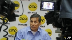 Peruvian presidential candidate Ollanta Humala speaks two days after the election at a local radio station in Lima, April 12, 2011