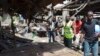 Rescue workers at the site of a suicide bomb attack at a market in Maiduguri , Nigeria, Tuesday, June 2, 2015. Boko Haram attacked the northeastern Nigerian city of Maiduguri with deafening explosions from the west and a suicide bombing near the center 