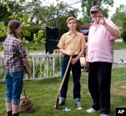 MADELINE CARROLL, CALLAN McAULIFFE and director ROB REINER on the set of Castle Rock Entertainment’s coming-of-age romantic comedy “FLIPPED,” a Warner Bros. Pictures release.