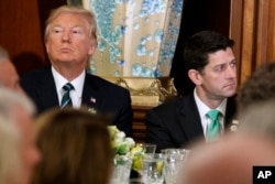 President Donald Trump, left, sits with House Speaker Paul Ryan on Capitol Hill in Washington during a "Friends of Ireland" luncheon, March 16, 2017.