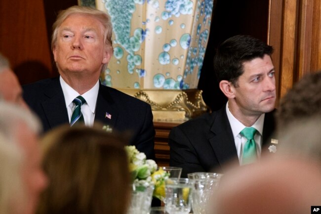 President Donald Trump, left, sits with House Speaker Paul Ryan on Capitol Hill in Washington during a "Friends of Ireland" luncheon, March 16, 2017.