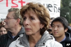 FILE - University of California, Davis Chancellor Linda Katehi waits to speak during a rally on campus in Davis, Calif., Nov. 21, 2011 after police pepper-sprayed peaceful demonstrators during a protest near the same spot on Friday.