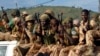 FILE - Chadian soldiers are seen sitting atop a pickup truck.