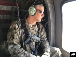 FILE - U.S. Army Lt. Gen. Stephen Townsend surveys positions during a tour north of Baghdad, Iraq, Feb. 8, 2017.