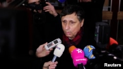 Candidate Jan Fischer speaks to the media after casting his vote in Prague, January 11, 2013.
