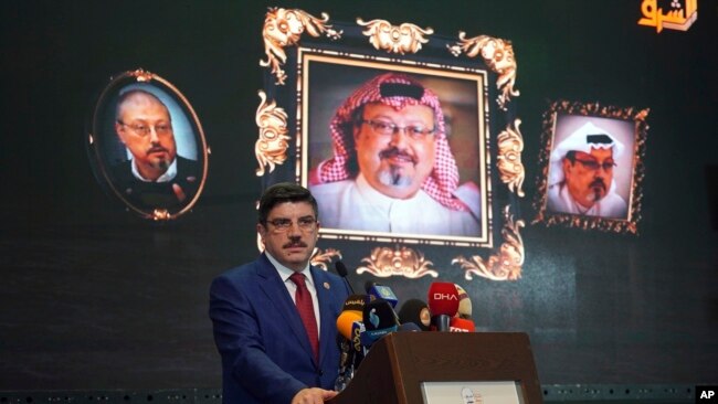 Yasin Aktay, an advisor to Turkey's President Recep Tayyip Erdogan, speaks during an event organized to mark the 40th day of the death of Saudi writer Jamal Khashoggi, in Istanbul, late Sunday, Nov. 11, 2018.