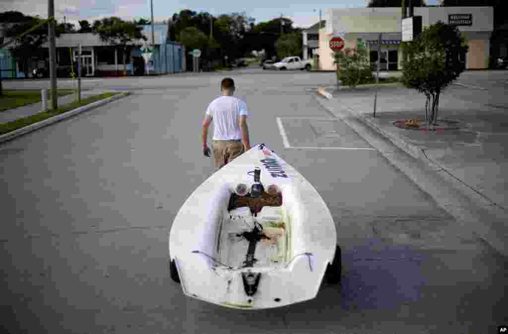 Emmett West pulls his boat from a nearby marina to secure it at his home ahead of landfall by Hurricane Florence in Morehead City, North Carolina, Sept. 11, 2018.