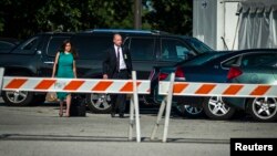 Bradley Manning's defense attorney David Coombs and his wife arrive at court for closing remarks in Manning's trial at Fort Meade, Maryland, July 26, 2013. 