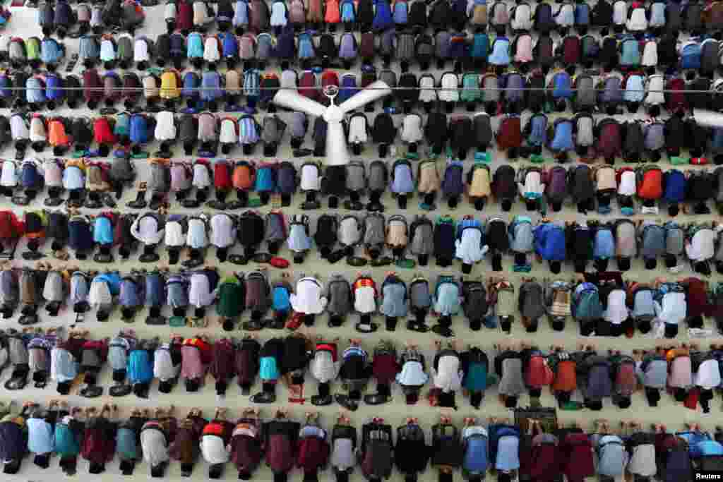 Muslim students from Ar-Raudhatul Hasanah Pesantren offer noon prayers on the first day of fasting during the holy month of Ramadan in Medan, North Sumatra, Indonesia in this photo taken by Antara Foto.