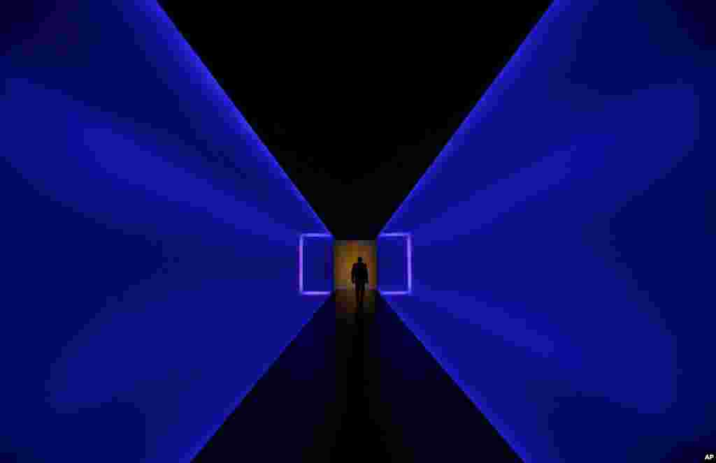 A man walks through a tunnel that connects two buildings of the Museum of Fine Arts in Houston, Texas, USA. The tunnel, titled The Light Inside, is a work by American artist James Turrell.