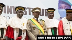 New interim Malian President, Colonel Assimi Goita (C), stands with members of the Supreme Court during his swearing in ceremony in Bamako on June 7, 2021. 