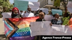 People march in downtown Nairobi, Kenya, during a protest organized by The Queer Republic in Nairobi, Jan.13, 2022. Education Cabinet Secretary Prof. George Magoha sparked controversy after saying that homosexuals students should be barred from boarding schools.