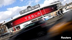 FILE - A Tesla car showroom is seen in west London, Britain, March 21, 2017. 